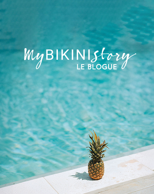 Ananas pos&eacute; sur le bord d'une piscine. 